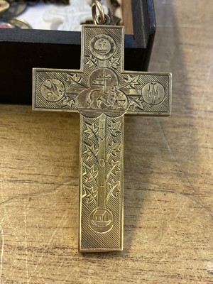 Lot 450 - Religious Artefacts. A Victorian yellow metal cross and religious medals