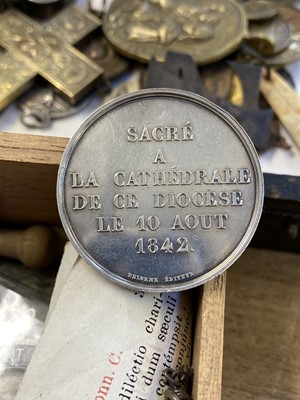 Lot 450 - Religious Artefacts. A Victorian yellow metal cross and religious medals