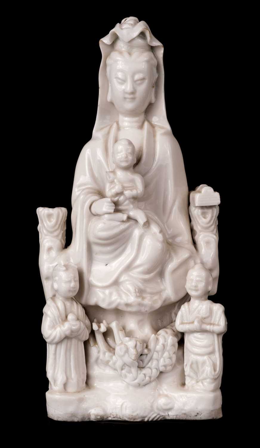 Lot 8 - Blanc de Chine Guanyin porcelain figural group, Qing, circa 1670
