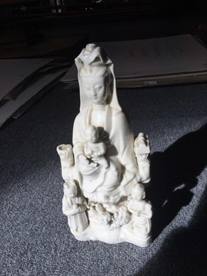 Lot 8 - Blanc de Chine Guanyin porcelain figural group, Qing, circa 1670