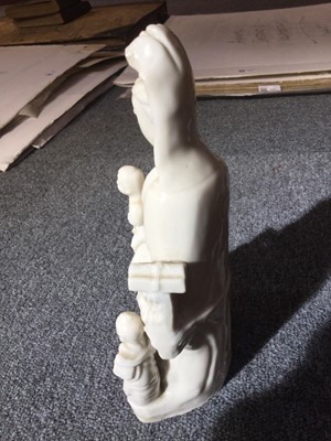 Lot 8 - Blanc de Chine Guanyin porcelain figural group, Qing, circa 1670