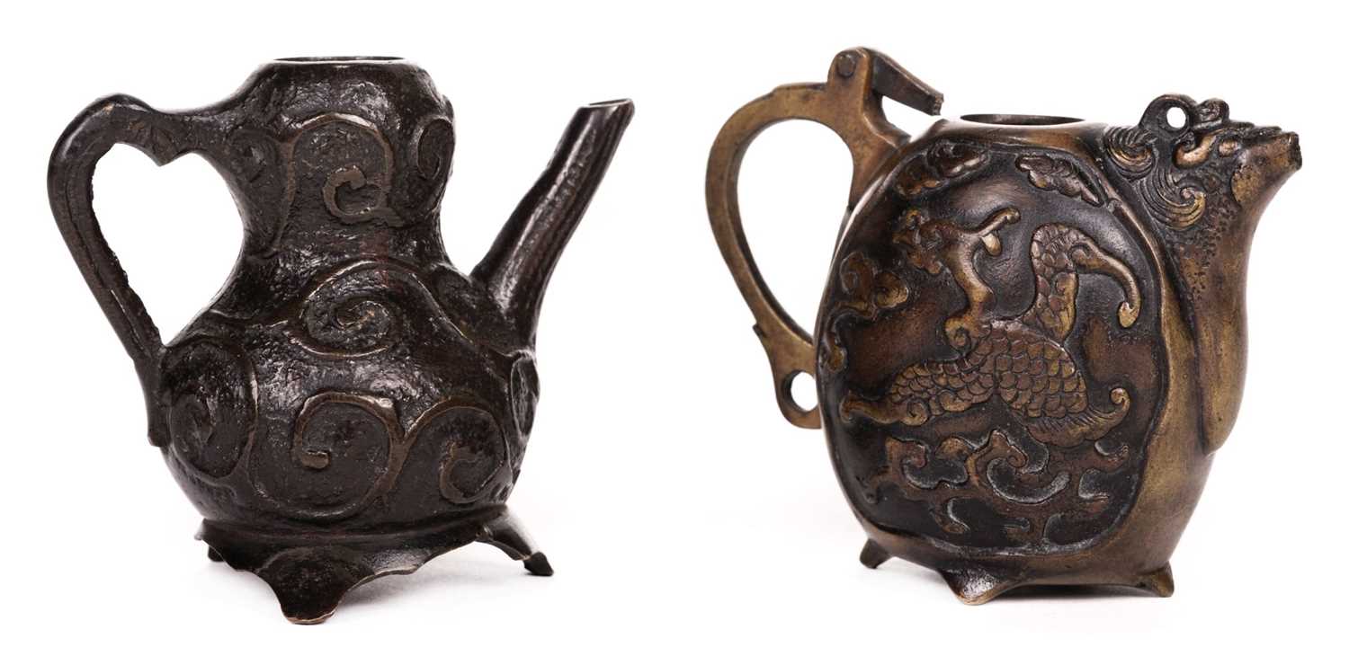 Lot 107 - Water Dropper. Metal teapot-shaped water droppers, 17th/19th Century