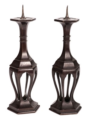 Lot 569 - Candle Holders. A pair of bronze hexagonal candle holders, 17th/18th Century
