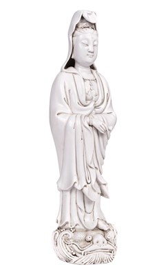 Lot 57 - Guanyin. Dehua monochrome white glazed figure of Guanyin, 20th Century