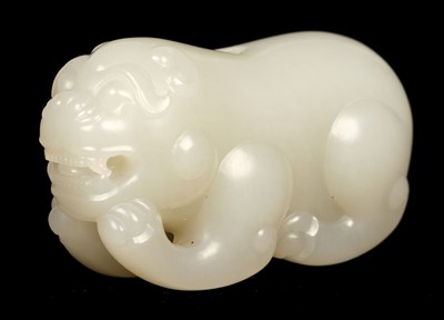 Lot 313 - Jade. A 20th century jade pebble carved as a dog