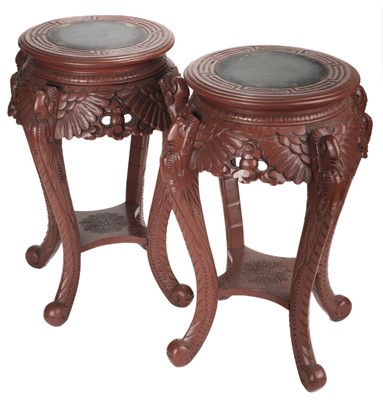 Lot 165 - Jardiniere stands. A Pair of Craved Oriental Jardiniere Stands.