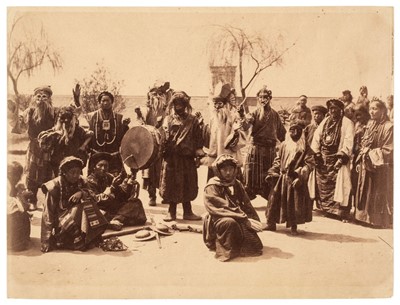 Lot 18 - Doyle (John, active India, 1872-1886). A group of Tibetan mummers from Lhasa