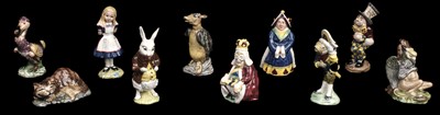 Lot 611 - Beswick. A group of Alice in Wonderland figures, issued 1973-1983