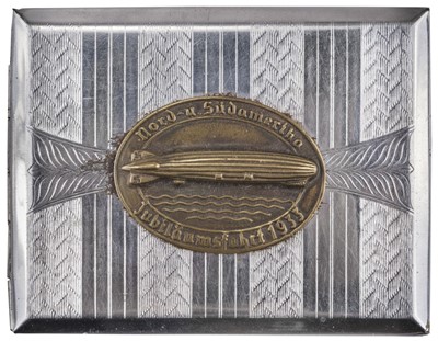 Lot 75 - Zeppelin. An art deco Zeppelin silver-plated cigarette case, circa 1930s