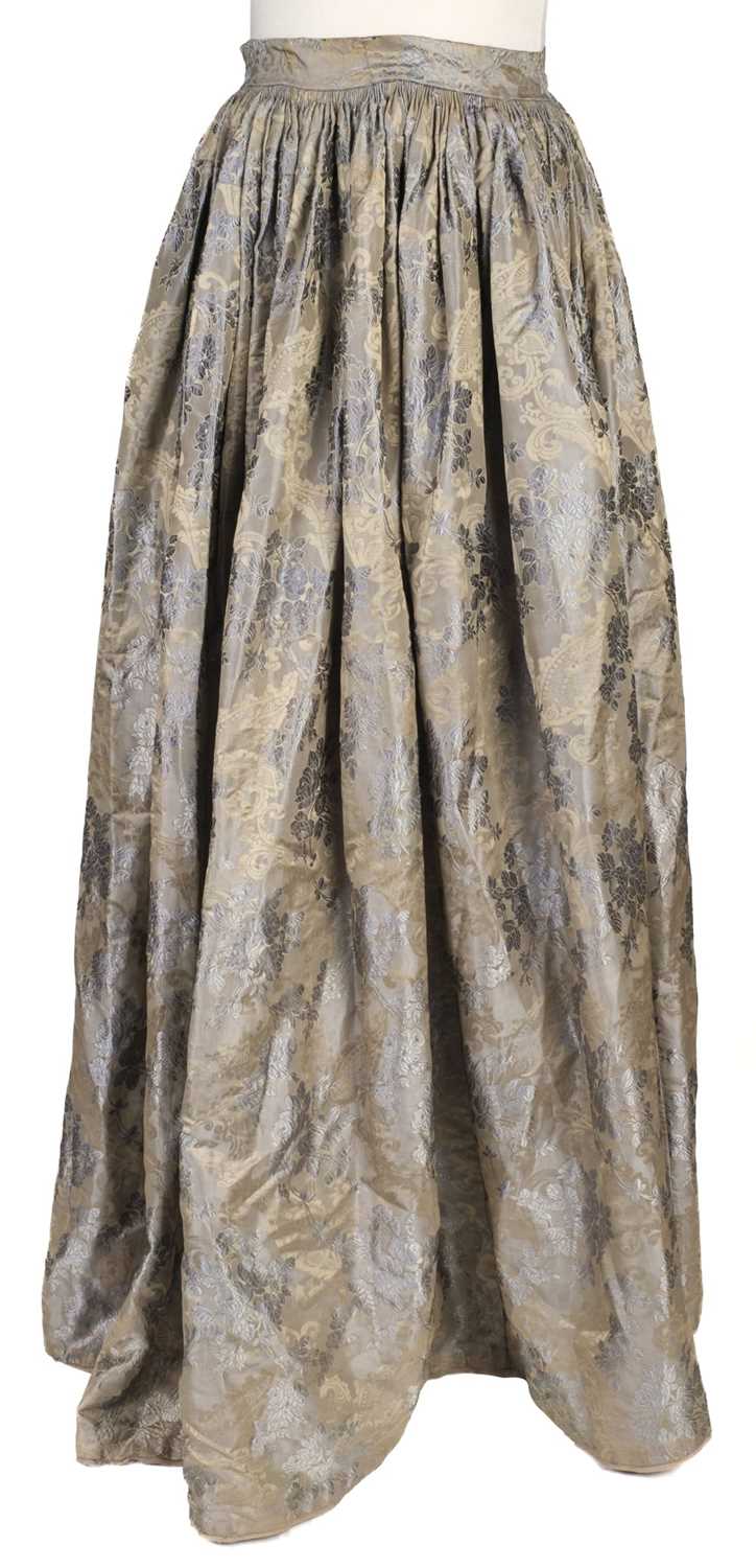 718 - Clothing.  A blue brocade skirt, circa 1850s, & other skirts, shoes, and waistcoats