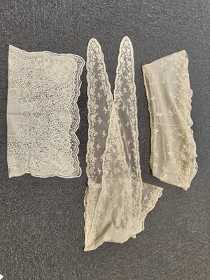 Lot 752 - Lace Veil. A tambour work appliqué veil, 19th century, & other tambourwork and needlerun lace items