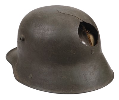 Lot 284 - WWI Helmet. A German P1916 steel helmet