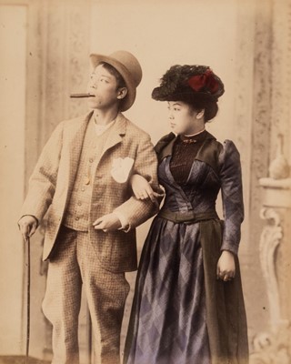 Lot 109 - Japan. A young Japanese couple in western clothes, c. 1880s