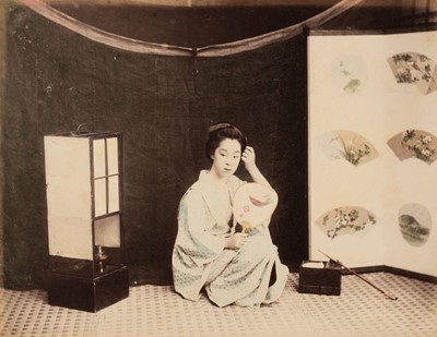 Lot 108 - Japan. A seated young Japanese woman with a mirror, c. 1880