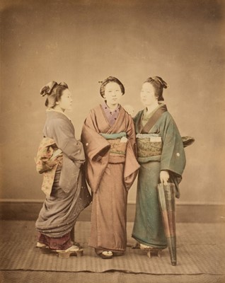 Lot 103 - Japan. A group of 3 standing young women in traditional dress