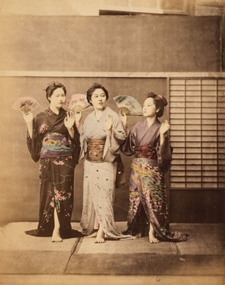 Lot 111 - Japan. Three young Japanese women in traditional dress