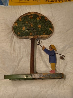 Lot 492 - Marble Tree Game. Apple Picker Game, circa 1920, wooden and tin base