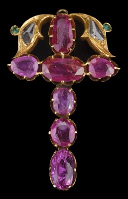 Lot 596 - Pendant. An Indian yellow metal crucifix pendant set with rubies, diamonds and emeralds