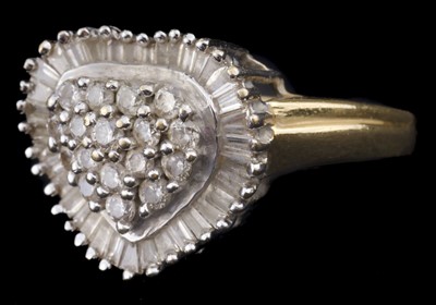 Lot 597 - Ring. An 18ct gold heart shape diamond ring