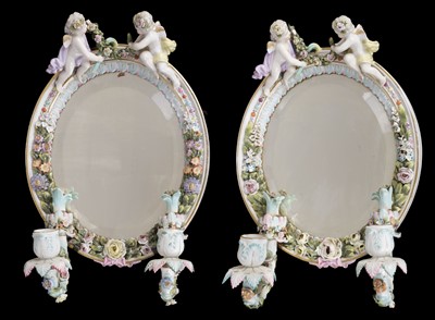 Lot 448 - Wall Mirrors. A pair of Dresden porcelain wall mirrors