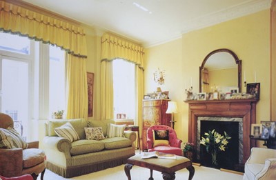 Lot 479 - Curtains. Two matching pairs of large yellow silk curtains with pelmets, 20th century