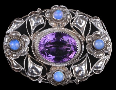 Lot 590 - Brooch. An Arts and Crafts white metal amethyst and moonstone brooch