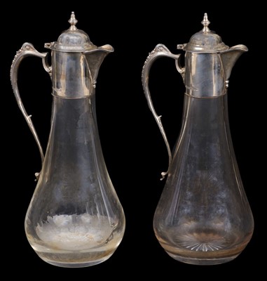 Lot 606 - Claret Jugs. A fine pair of silver mounted glass claret jugs, Sheffield 2002