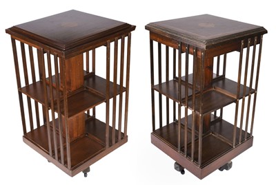 Lot 223 - Bookcases. A matched pair of Edwardian style mahogany inlaid revolving bookcases