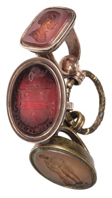 Lot 592 - Fobs. A George III gold plated fob, inset with a carnelian armorial intaglio