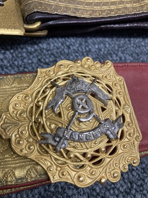 Lot 81 - Military Belts. An Edwardian belt of the 9th Lancers and other belts