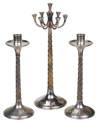 Lot 514 - Table Suite. A silver candlestick converted to seven light candelabra designed by Anthony Elson