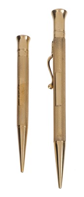 Lot 518 - Gold Pencils. A 9ct gold propelling pencil by E Baker and Son, Birmingham