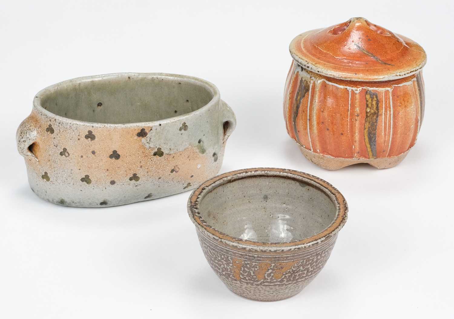 Lot 433 - Tudball (Ruthanne, 1948-). A faceted stoneware jar and cover and two other salt glazed pots