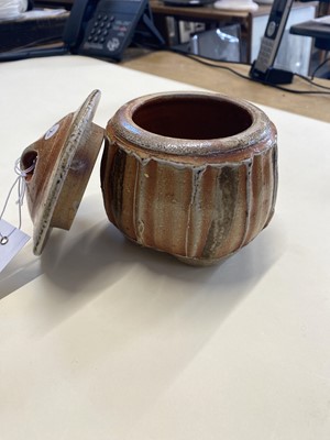 Lot 433 - Tudball (Ruthanne, 1948-). A faceted stoneware jar and cover and two other salt glazed pots
