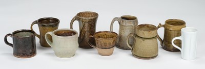 Lot 428 - Studio Pottery. A collection of nine mugs