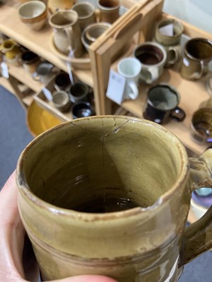 Lot 428 - Studio Pottery. A collection of nine mugs