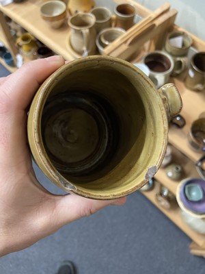 Lot 428 - Studio Pottery. A collection of nine mugs