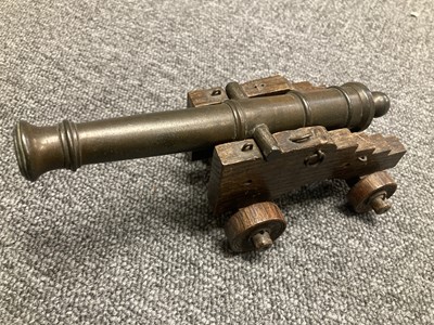 Lot 74 - H.M.S. Royal George. A model cannon with engraved barrel