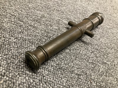 Lot 74 - H.M.S. Royal George. A model cannon with engraved barrel