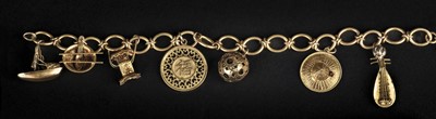 Lot 519 - Gold. A gold charm bracelet