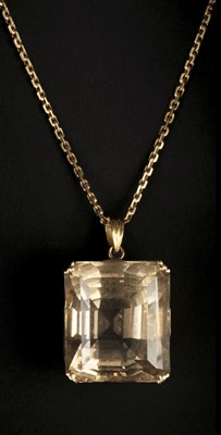 Lot 524 - Pendant. A 22k gold pendant set with a large facet cut smoky quartz