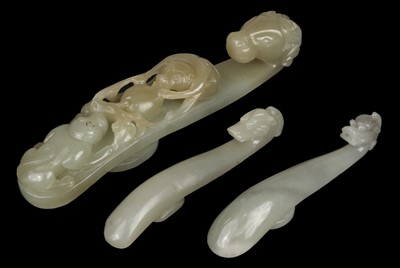 Lot 492 - Jade. Three Chinese jade belt hooks