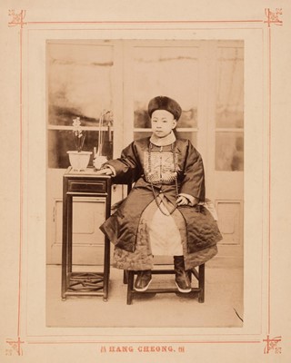 Lot 33 - China. Portrait of a young boy in traditional dress, by Hang Cheong, c. 1890s, albumen print