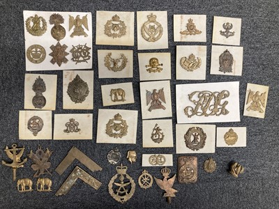 Lot 60 - Cap Badges. A collection of military cap badges