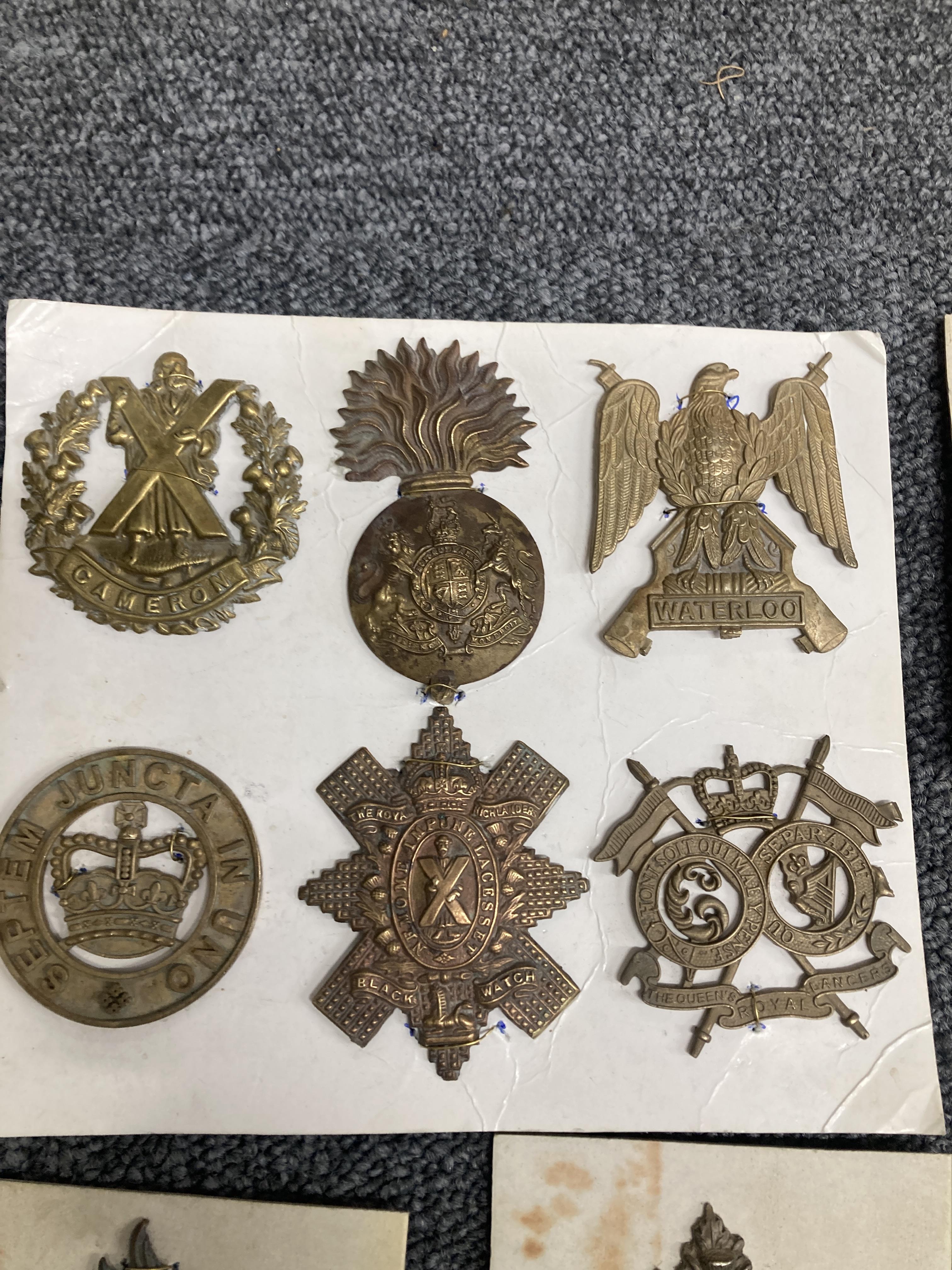 Lot 60 - Cap Badges. A collection of military cap