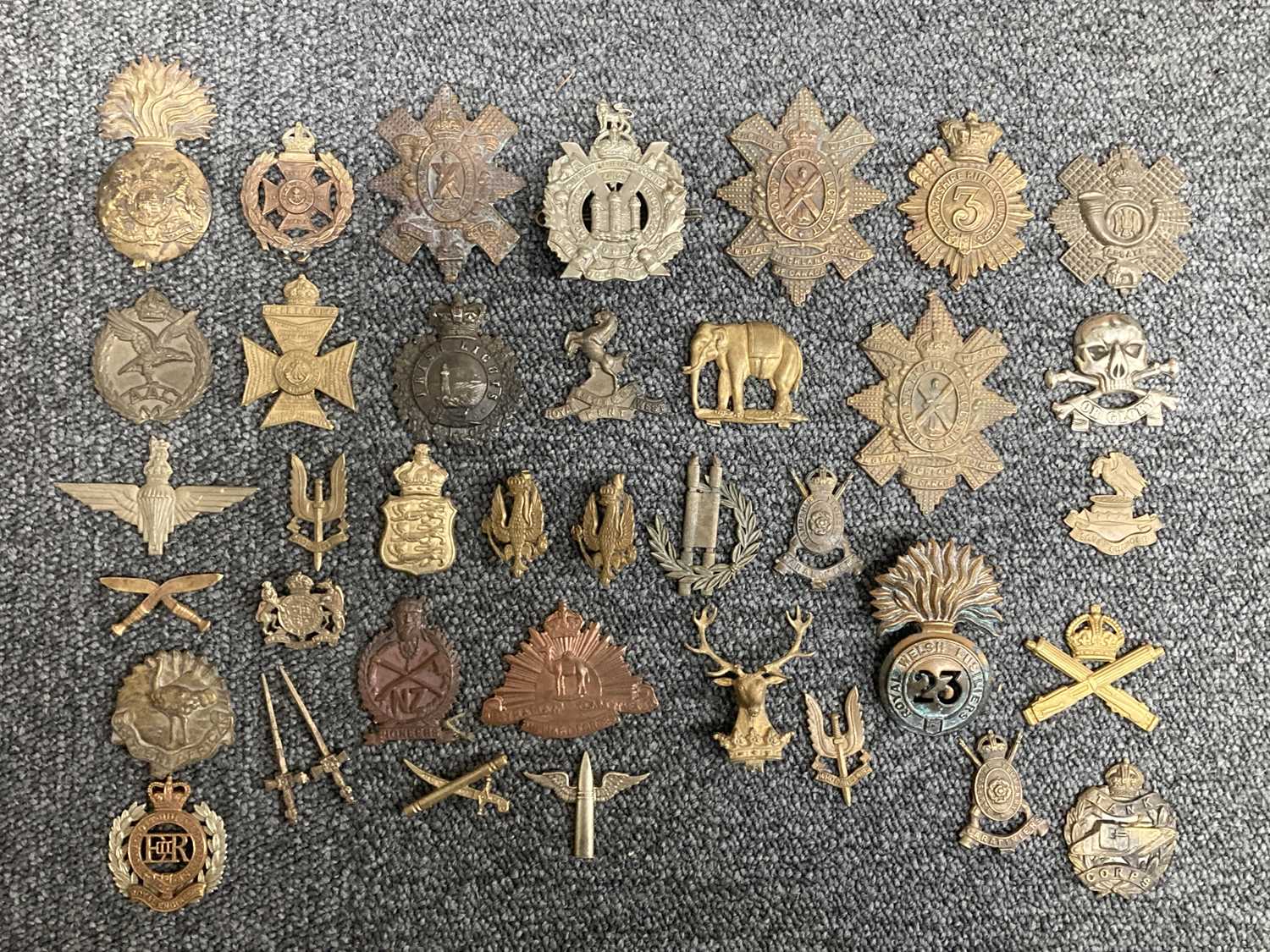 Lot 61 - Cap Badges. Victorian and WWI regimental cap badges