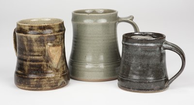 Lot 403 - Leach Pottery. Three beer tankards