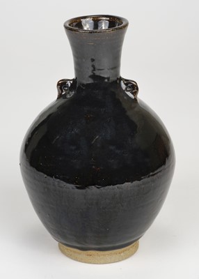 Lot 381 - Corser (Trevor, 1938-2015). A footed stoneware bottle vase with lugs