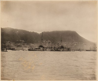 Lot 57 - Hong Kong. A view of Central, Hong Kong, with a British battleship in the foreground, c. 1902