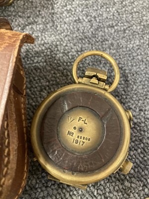 Lot 62 - Compass. A WWI officer's brass compass and other military items